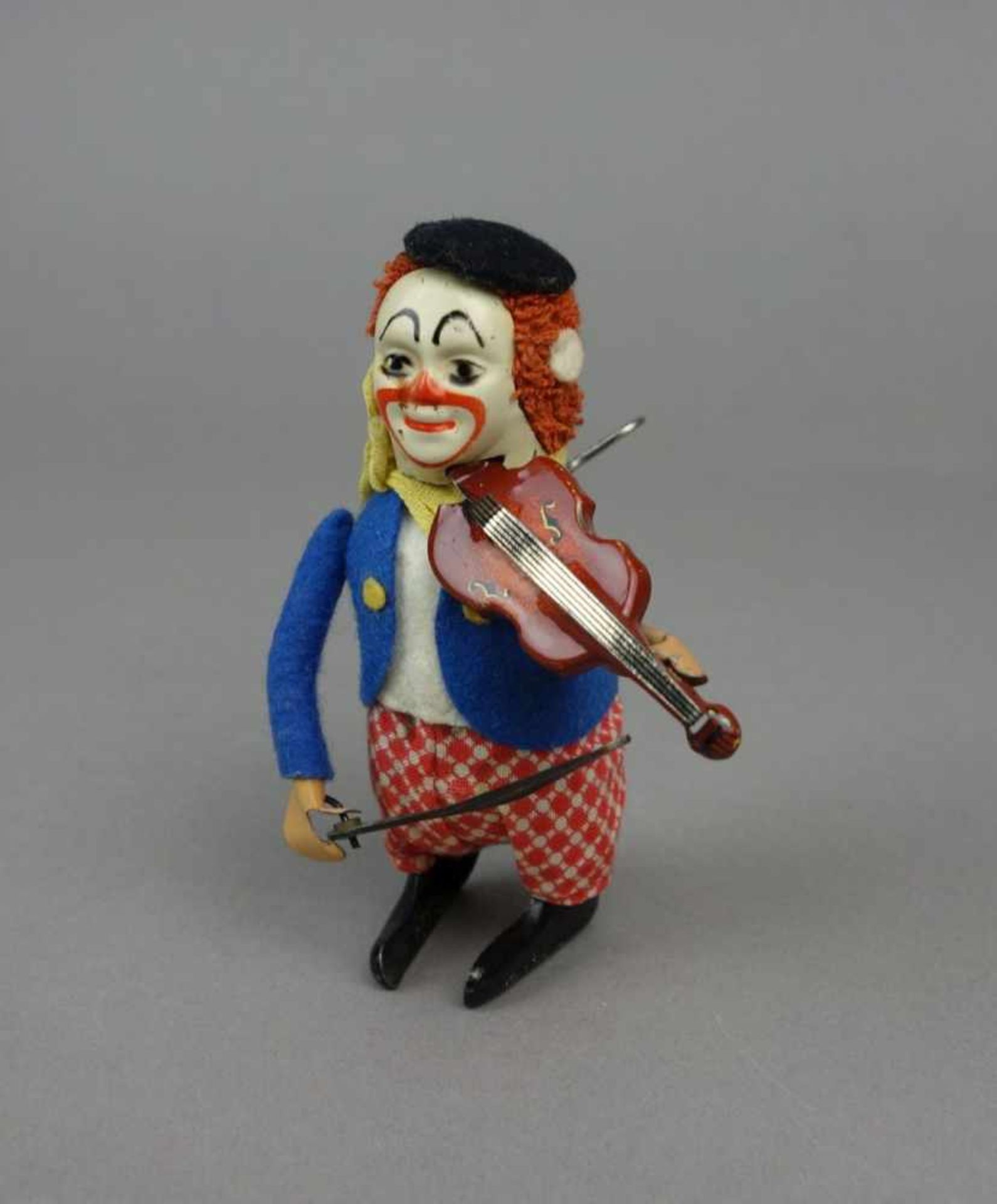 BLECHSPIELZEUG: Tanzfigur Clown mit Violine / tin toy - dancing figure, Mitte 20. Jh., polychrom