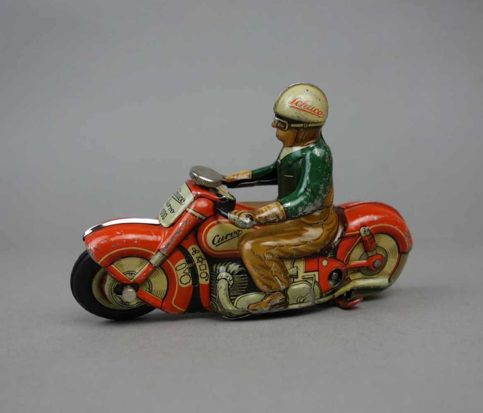 BLECHSPIELZEUG: SCHUCO MOTORRAD MIT BELEUCHTUNG / MOTORRADFAHRER / tin toy bike, Mitte 20. Jh. /