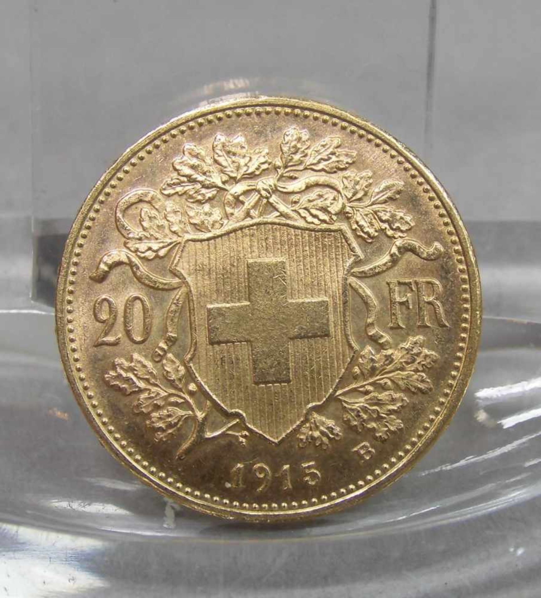 GOLDMÜNZE: 20 FRANKEN / gold coin, Schweiz, 1915, 6,4 Gramm, 900er Gold. Avers: Wappenschild der