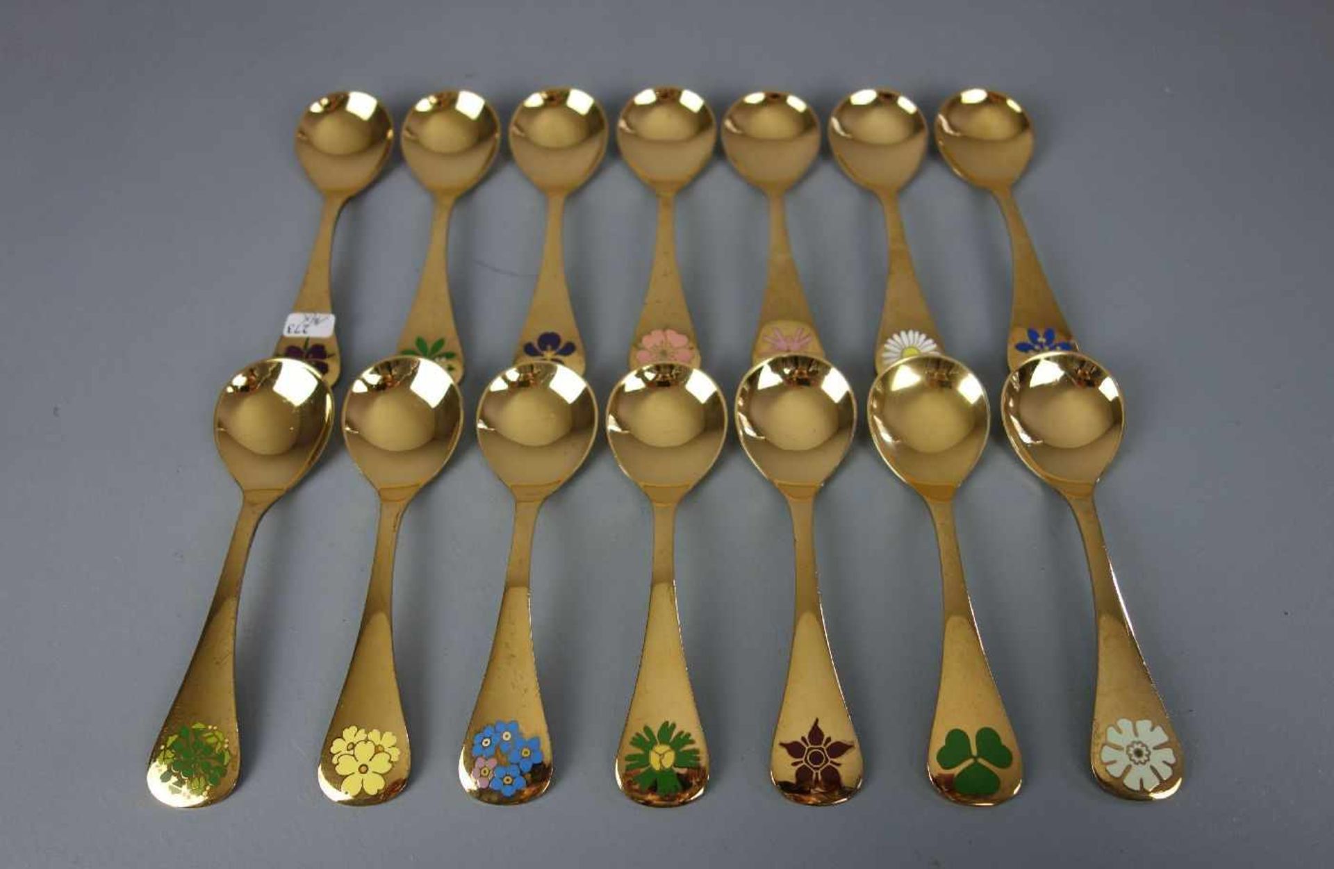 GEORG JENSSEN JAHRESLÖFFEL / silver spoons, 14 Stück, Sterlingsilber (insgesamt 624 g), vergoldet