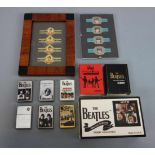 THE BEATLES MERCHANDISE / MEMORABILIA: KONVOLUT FEUERZEUGE UND ZIGARREN-BANDEROLEN. 8 Zippo-