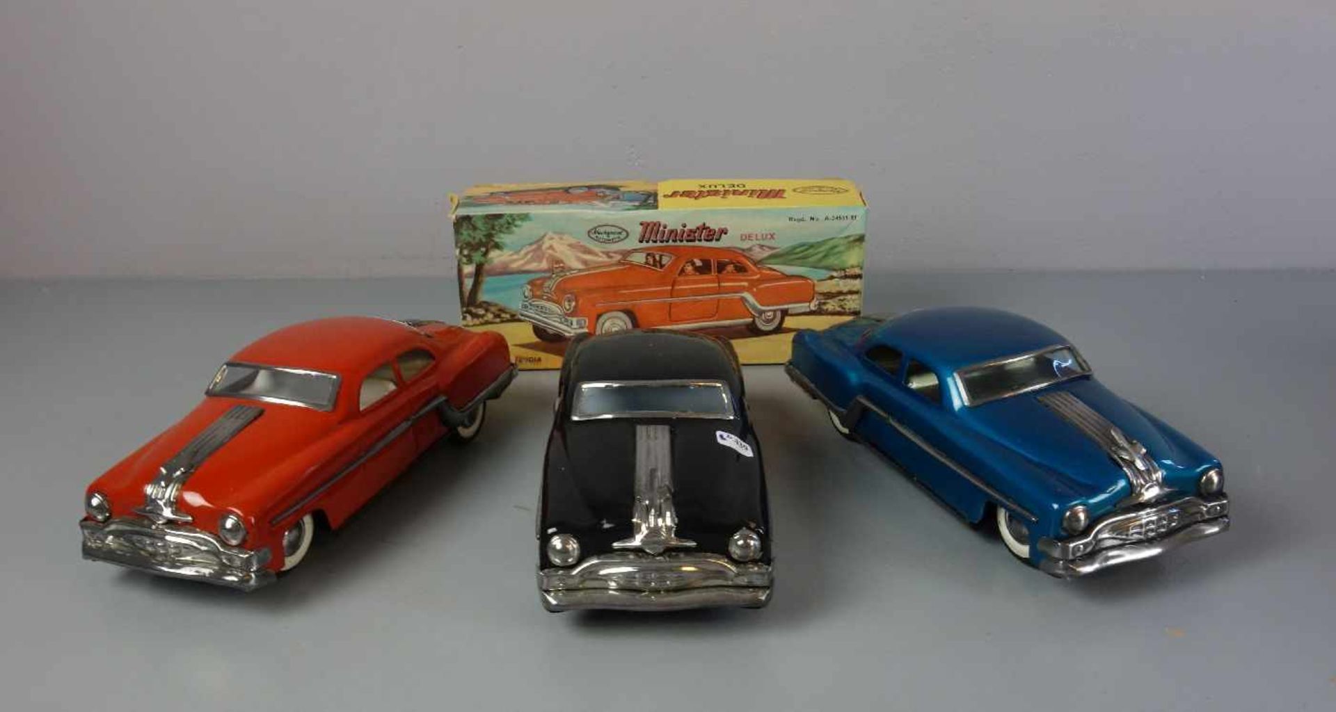 BLECHSPIELZEUG / FAHRZEUGE: 3 AUTOS - MINISTER - DELUX / three tin toy cars, Mitte 20. Jh.,