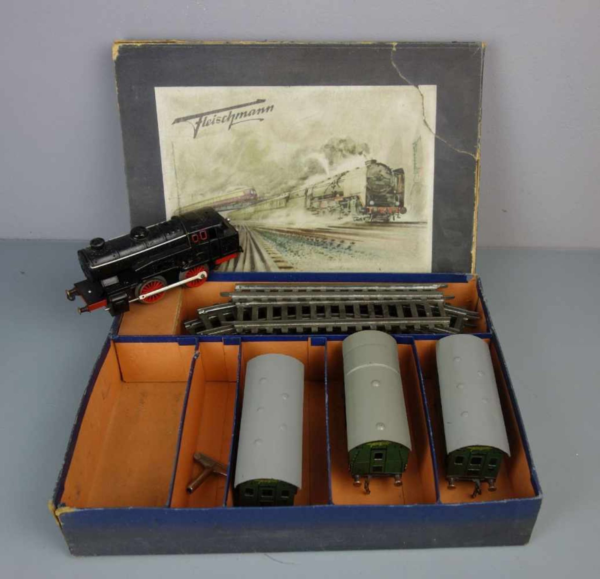 BLECHSPIELZEUG / EISENBAHN-SET: Dampflok-Set im Karton / tin toy railway, um 1950, Manufaktur