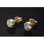 Paar GG 585 Ohrstecker mit Brillanten (zus. ca. 0.60ct/SI/W), 1,6gPair of GG 585 earrings with