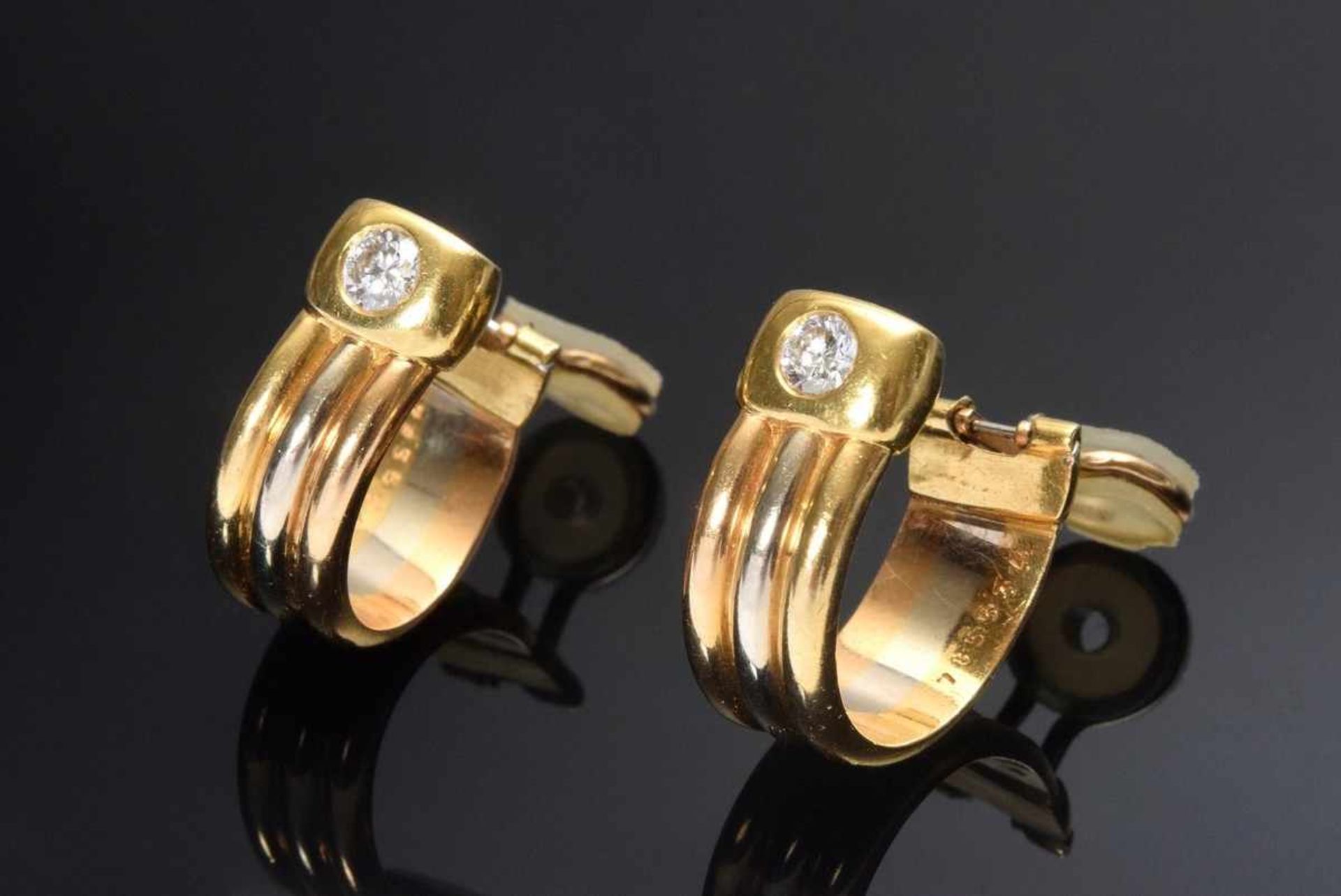 Paar GG 750 Cartier „Trinity“ Creolenclips mit Brillanten (zus.ca. 0.30ct/VVSI/TW), 16,81g, Stempel: