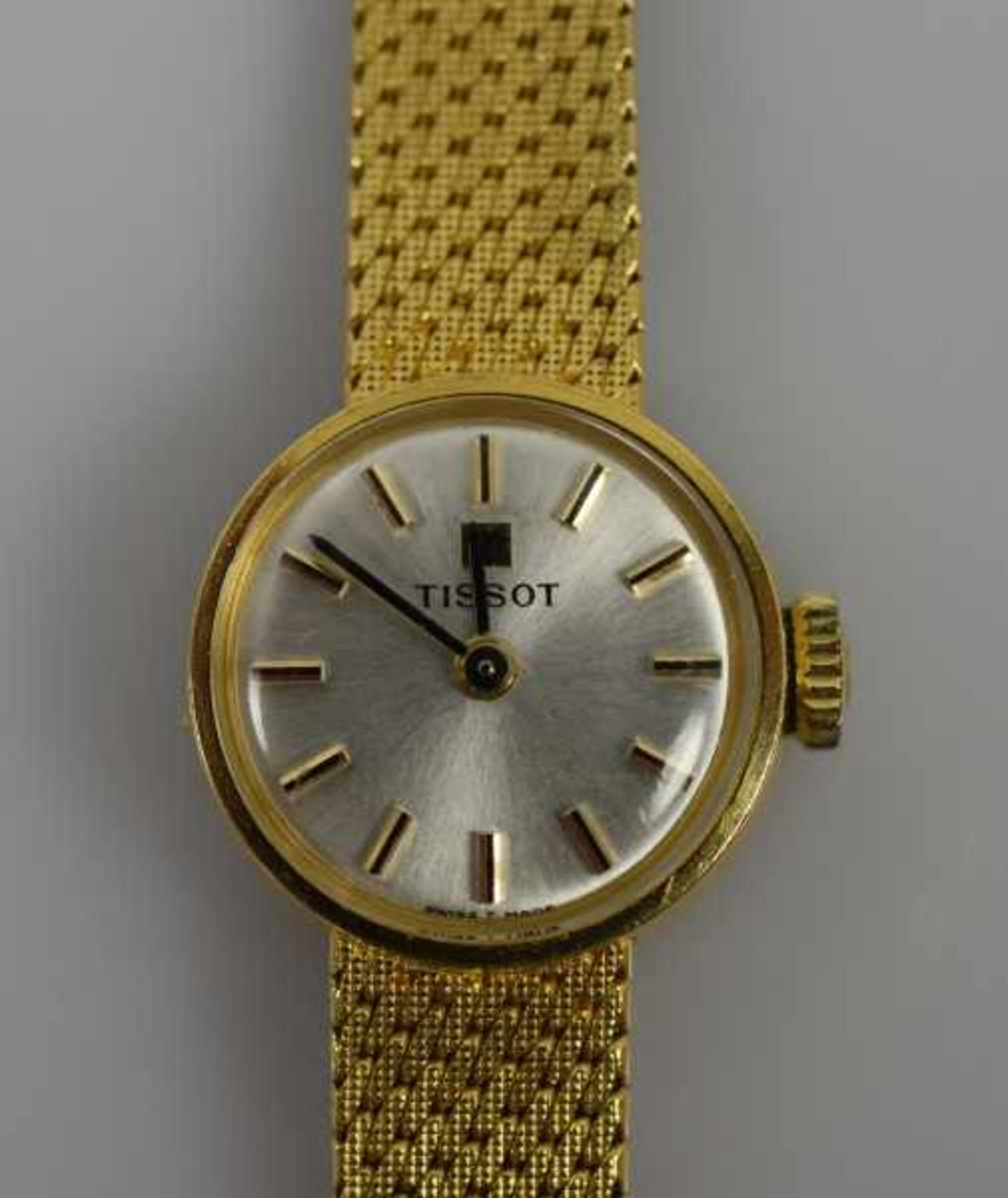 DAMENARMBANDUHR Tissot, Handaufzug, kleines rundes Goldgehäuse mit Goldband 18ct, Bodennummer 19560,