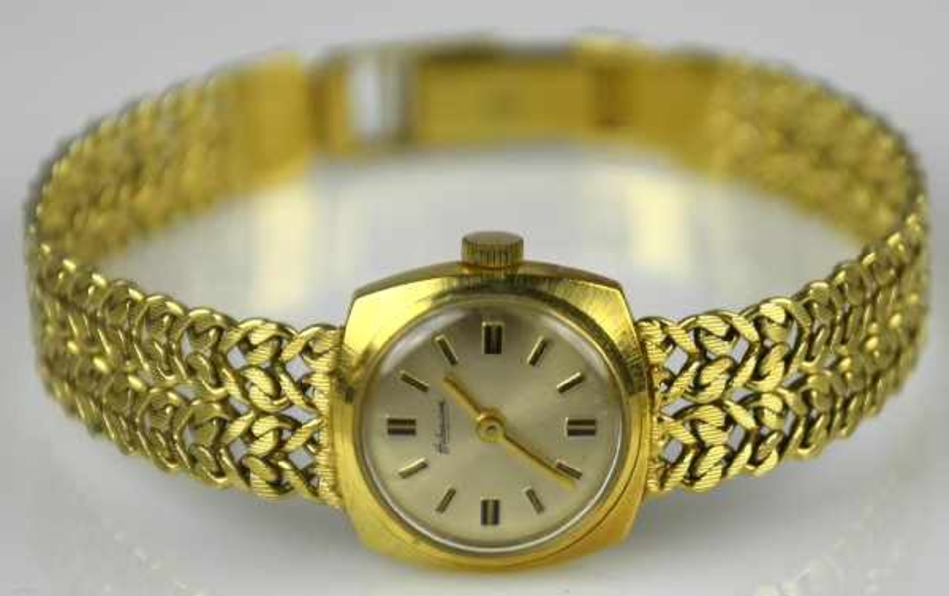 DAMENARMBANUHR Habmann, Handaufzug, viereckiges Goldgehäuse mit durchbrochenem, satiniertem Armband,