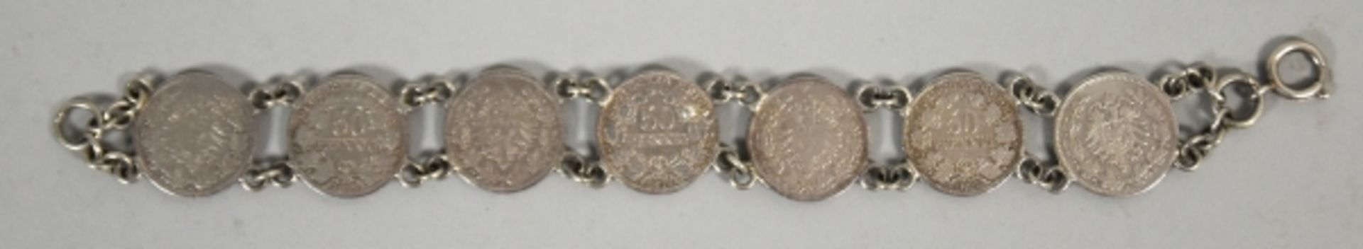 2 TEILE BURSCHENSCHAFT bestehend aus Armband mit 7 50-Pfennig Münzen u. farbiges Band mit Silber-