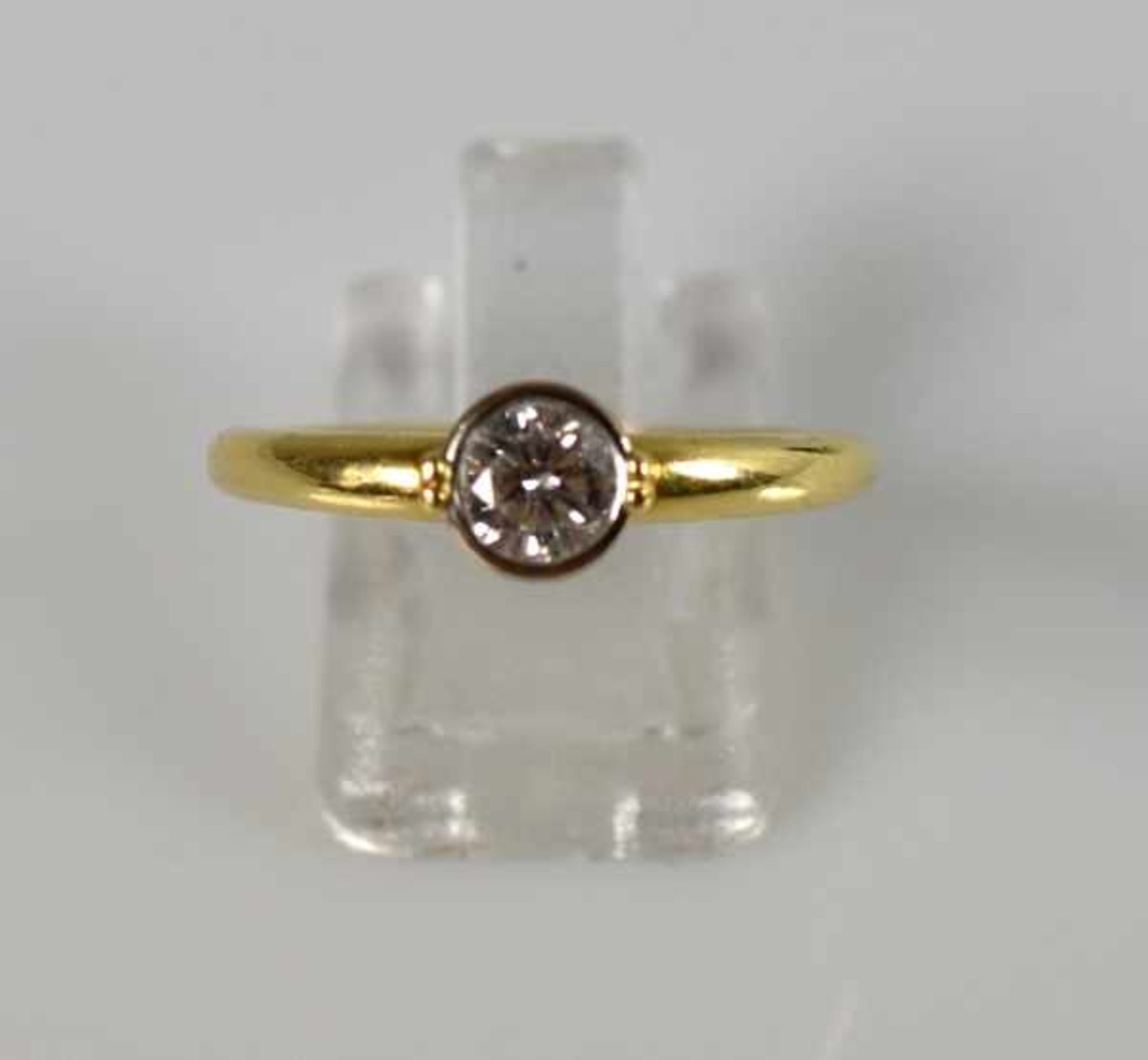 BRILLANTRING mit Solitärbrillant 0,75ct, w, si, in Goldfassung 18ct, 4,4g, Gr. 59