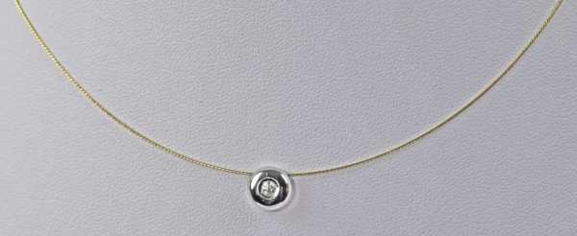 COLLIER Jo-Jo-Anhänger mit kleinem Brillant um 0,1ct in polierter Weißgoldfassung an feinem Goldseil