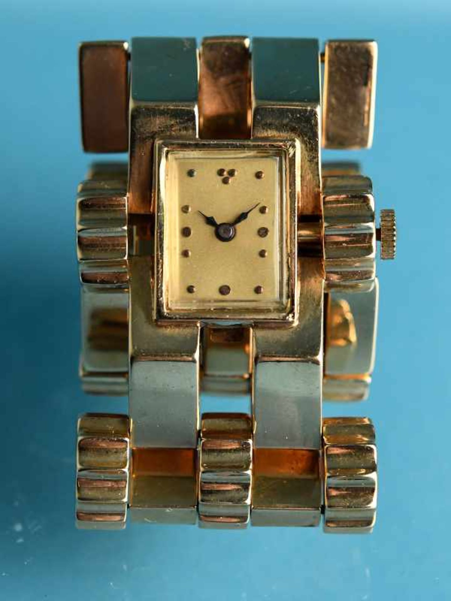 Gliederarmband mit Uhr, 70-er Jahre. 585/- Roségold. Gesamtgewicht ca. 82,8 g. Fünfreihiges