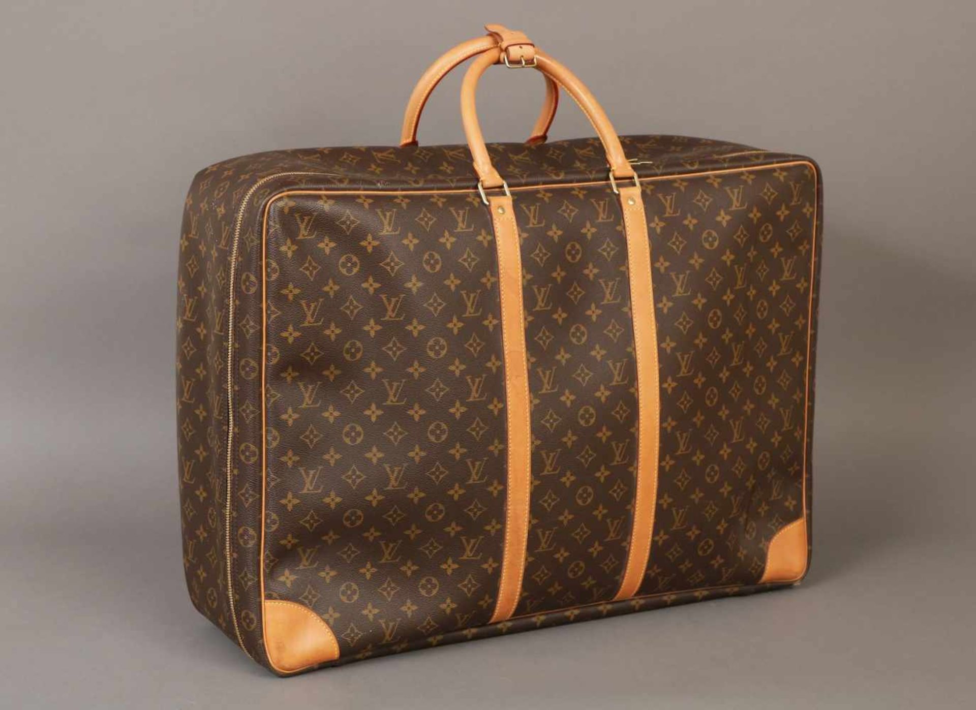 LOUIS VUITTON Sirius ¨Soft shell¨ KofferMonogramm-Canvas, braun, mit beigen Ledergriffen und Gurten,