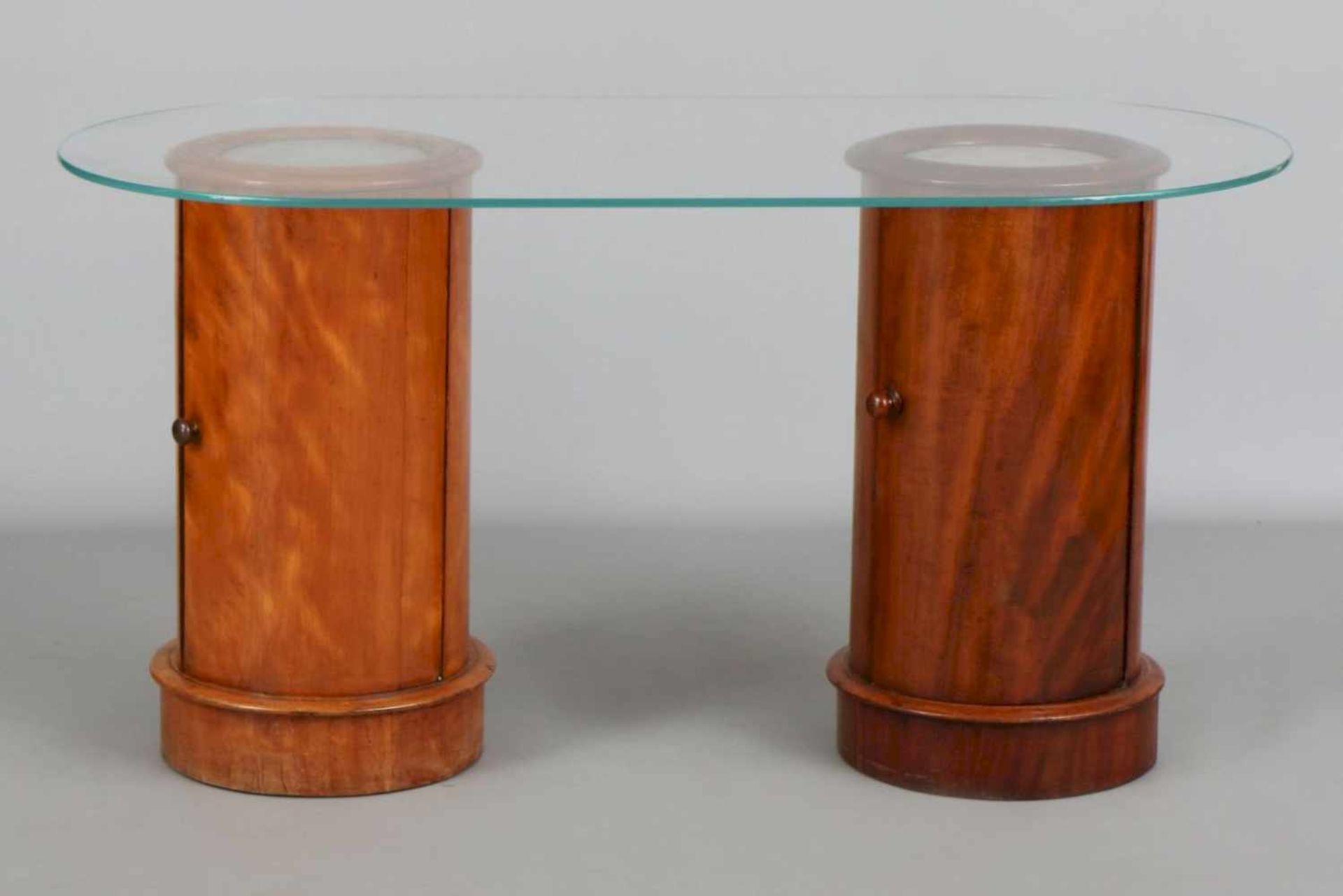 2 Biedermeier Trommelschränke mit aufgelegter Glas-Schreibplatteje 1-türiger, zylindrischer