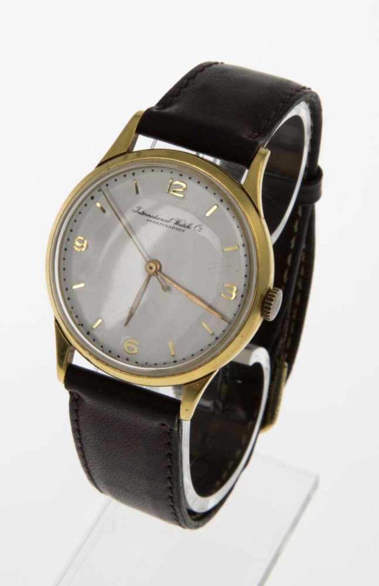 Elegante IWC-ArmbanduhrRundes Gehäuse aus Gelbgold 750. Plexiglas. Versilbertes Zifferblatt mit