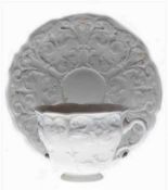 Meissen-Kaffeetasse mit UT, 19. Jh., reich floral reliefiert, min. Restvergoldung, 1. Wahl