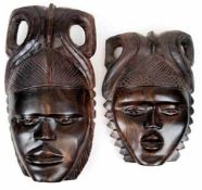 2 Masken, Zentralafrika 20. Jh., Ebenholz, geschnitzt, 31x22 cm u. 40x21 cm