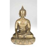 Buddha, 1920/30, Bronze, auf Lotossockel sitzend, die Hände in Bhumisparsha Mudra-Geste,H. 37