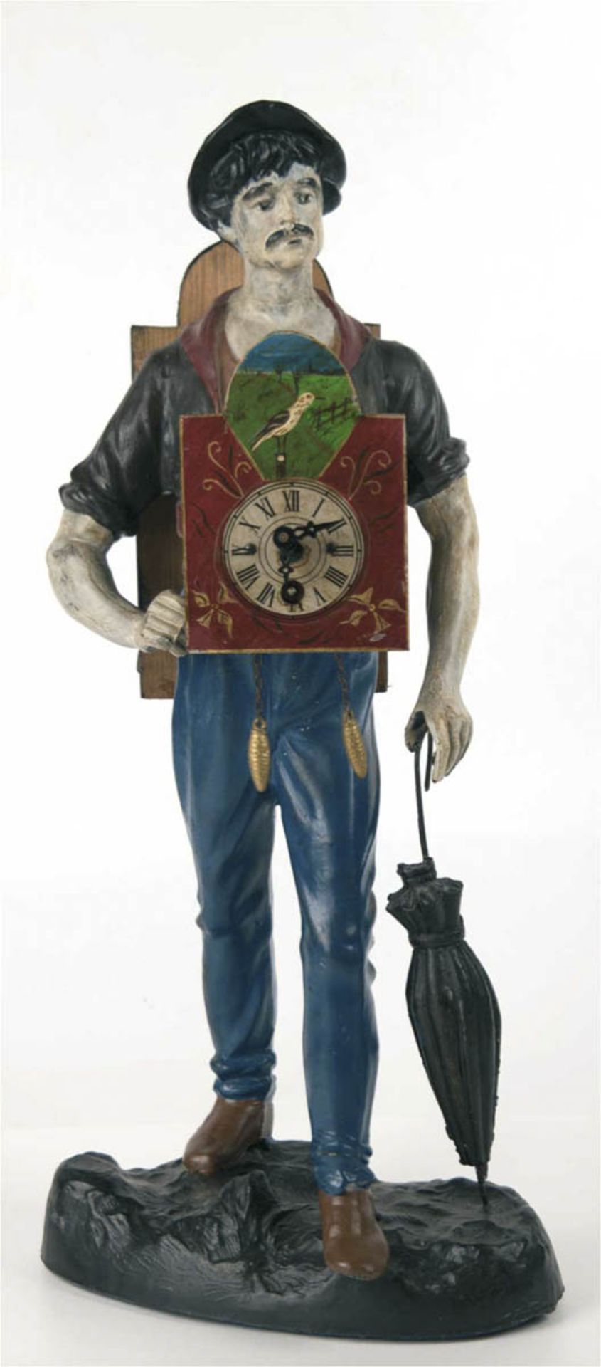 Uhrenmännchen, 20. Jh., Metall farbig gefaßt, vor dem Bauch eine Kuckucksuhr tragend,defekt,