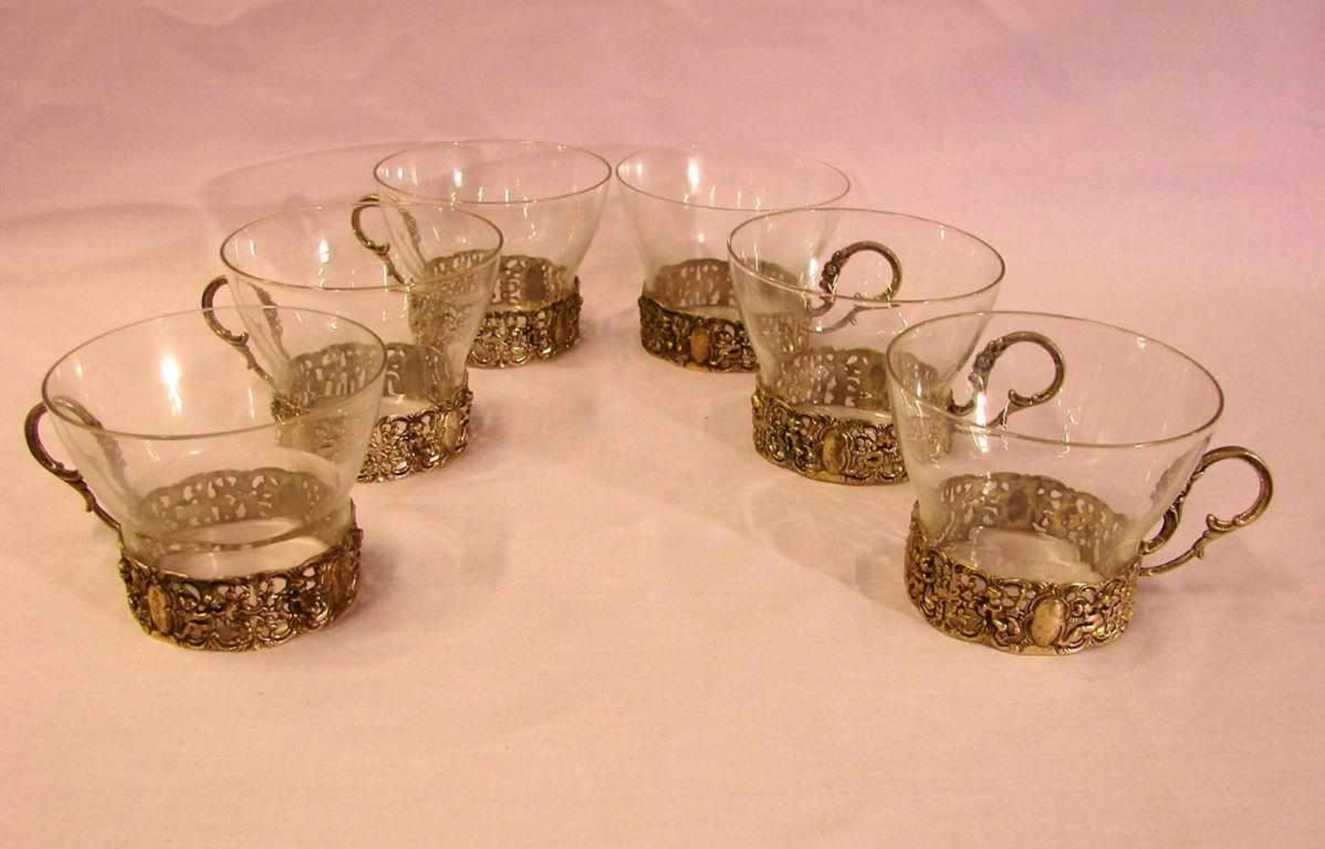 6 Teegläser mit verz. Silberfuß, 835er Silber, H. ca. 6 cm