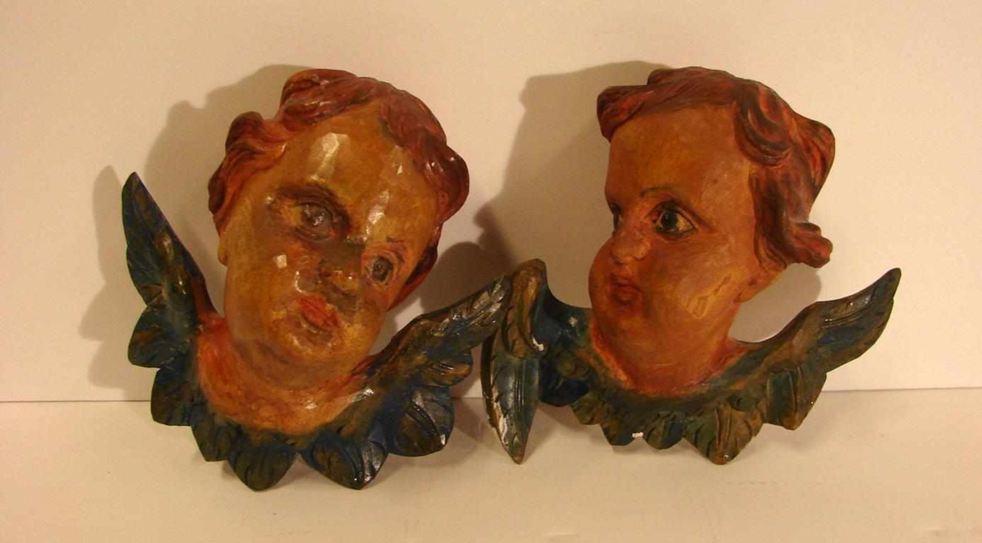 Paar Puttenköpfe, Holz, H. ca. 12, B. 13 cm