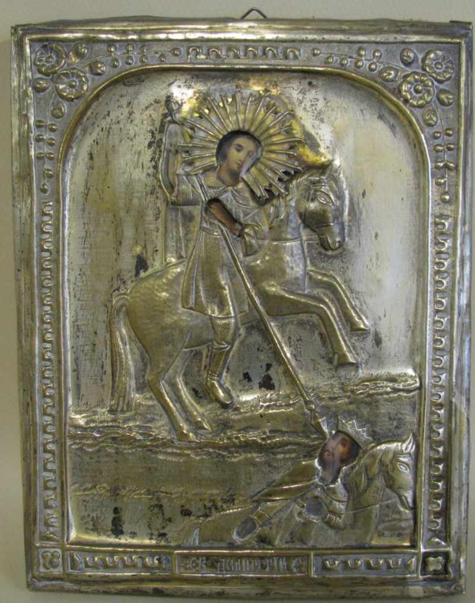 Ikone, Russland, 19. Jahrhundert, 'Heiliger zu Pferd', vergoldetes Messingoklad, 23 x 17,5 cm.