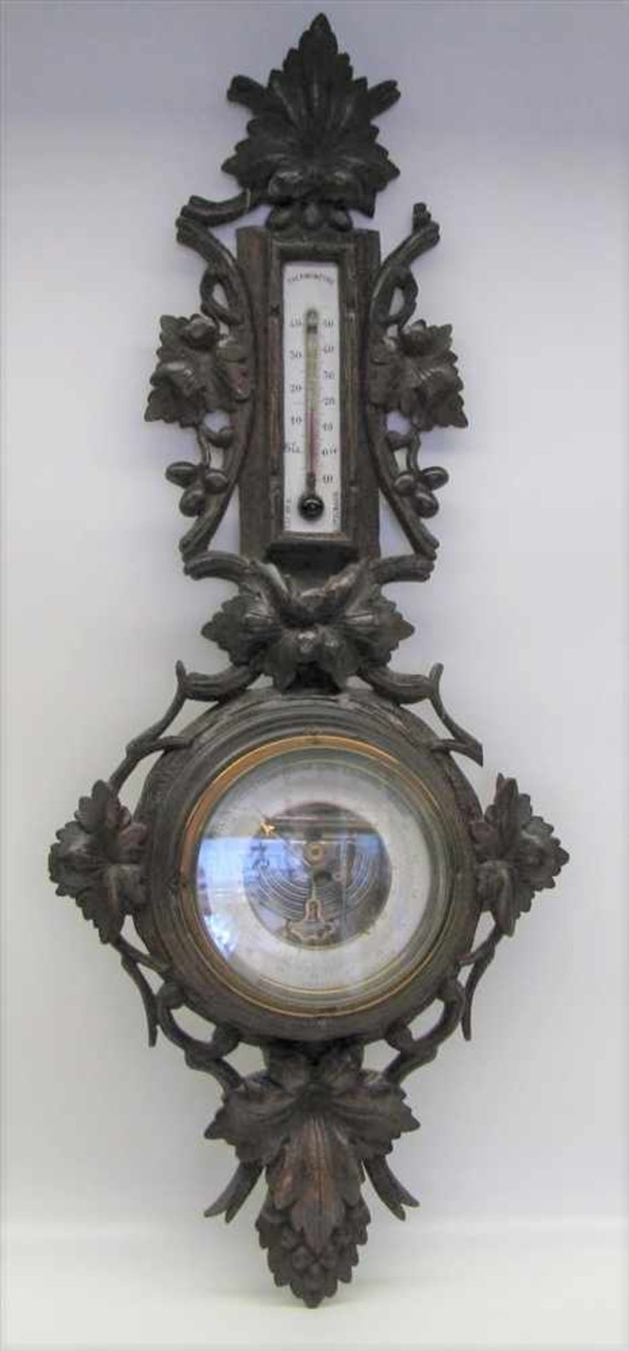 Barometer, Deutsch, 19. Jahrhundert, Eiche beschnitzt, besch., 69 x 28,5 cm.