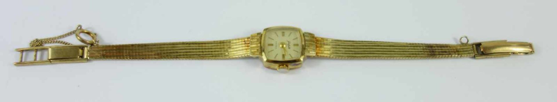 Damenarmbanduhr Glashütte, 585 GelbgoldTonneaugehäuse, helles Zifferblatt mit Balkenindizes,