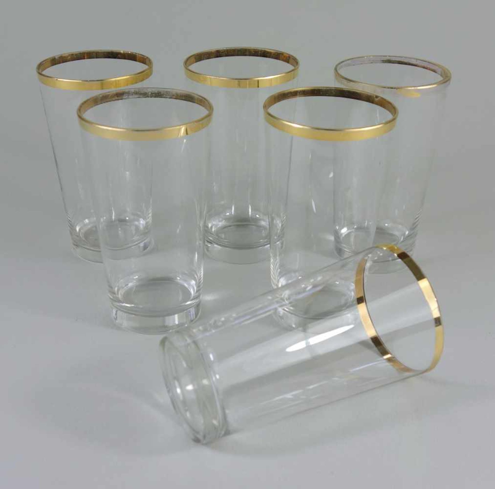 6 Gläser mit Goldrand, 20er JahreKlarglas, plangeschliffener Stand, Goldrand tlw. leicht berieben,