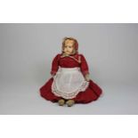 Puppe, Schildkröt 1909, Marke im Nacken, Kunststoff Oberkörper, Beine aus Leder, Arme aus Stoff, L.: