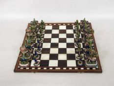 Schachspiel32 Figuren Emaille auf Silberblech (z.T. minimal beschädigt), Spielbrett Holz, Elfenbein,