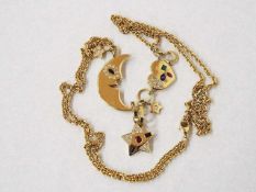 Collier585er Gelbgold, mit Mond, Sternen und Herz mit Smaragd, 4 Saphiren, 2 Rubinen und 54