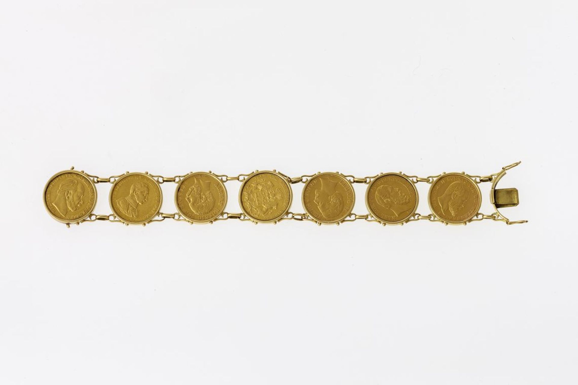 MünzarmbandSieben 20-Mark-Goldmünzen (GG, 900) in glatten Fassungen (GG, 750). Dt. Reich, 1876-1914,
