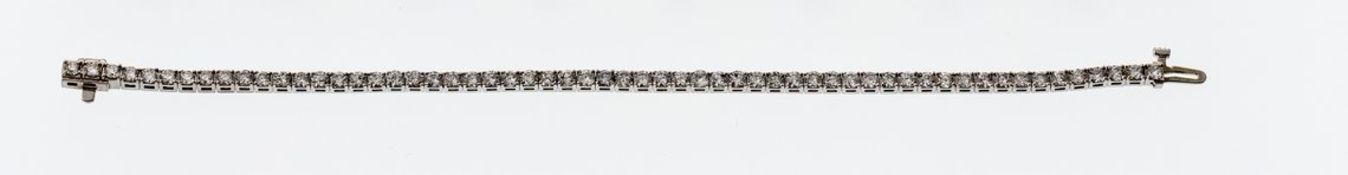 TennisarmbandWG, 585. Rivière-Armband, besetzt mit 58 Brillanten von zusammen ca. 4 ct, in