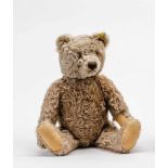 Steiff-Teddy ZottyCaramelfarbener Mohair (bespielt, an Pfote Riss, Stimme defekt). L. 51 cm