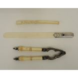 Papiermesser, Zigarettenspitze und NussknackerPapiermesser, Klinge aus Elfenbein, silberner Griff