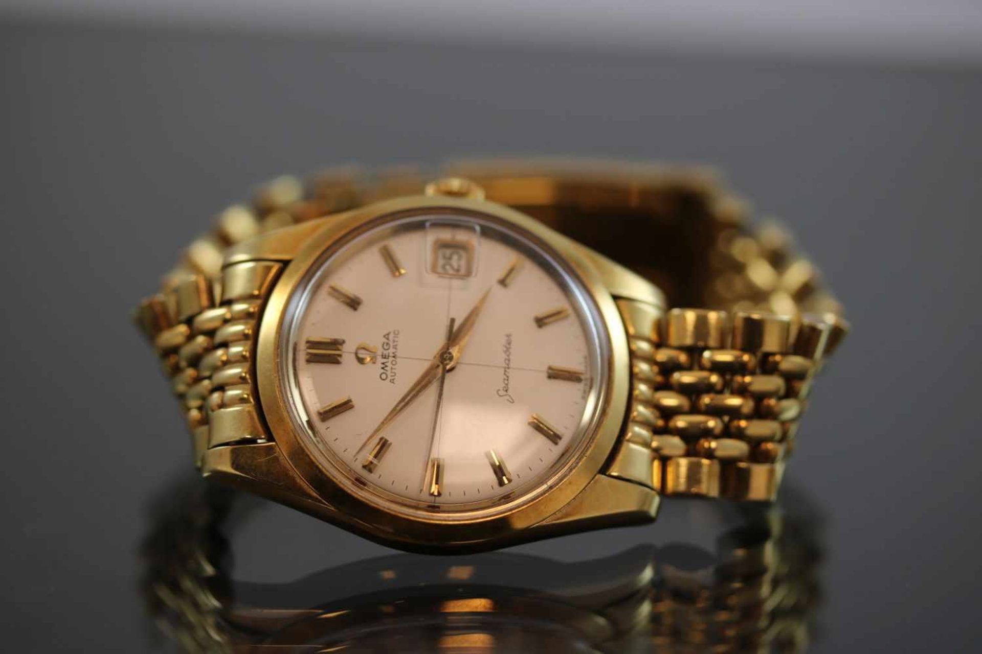 Omega SeamasterWerk: AutomatikBand: 750 GoldFunktion: DatumsanzeigeGehäuse Ø: 3,5 cm Gewicht ges.: