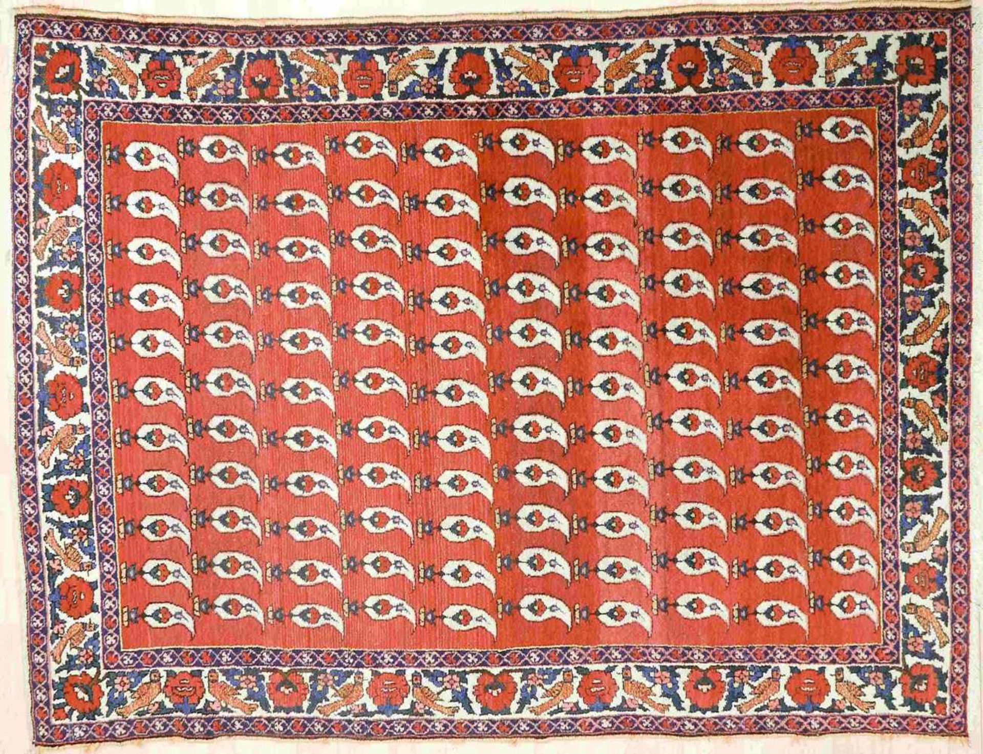 Teppich, wohl Bachtiari, älter, 20. Jh.Baumwolle/Wolle. Breite Hauptbordüre mit Blüten und