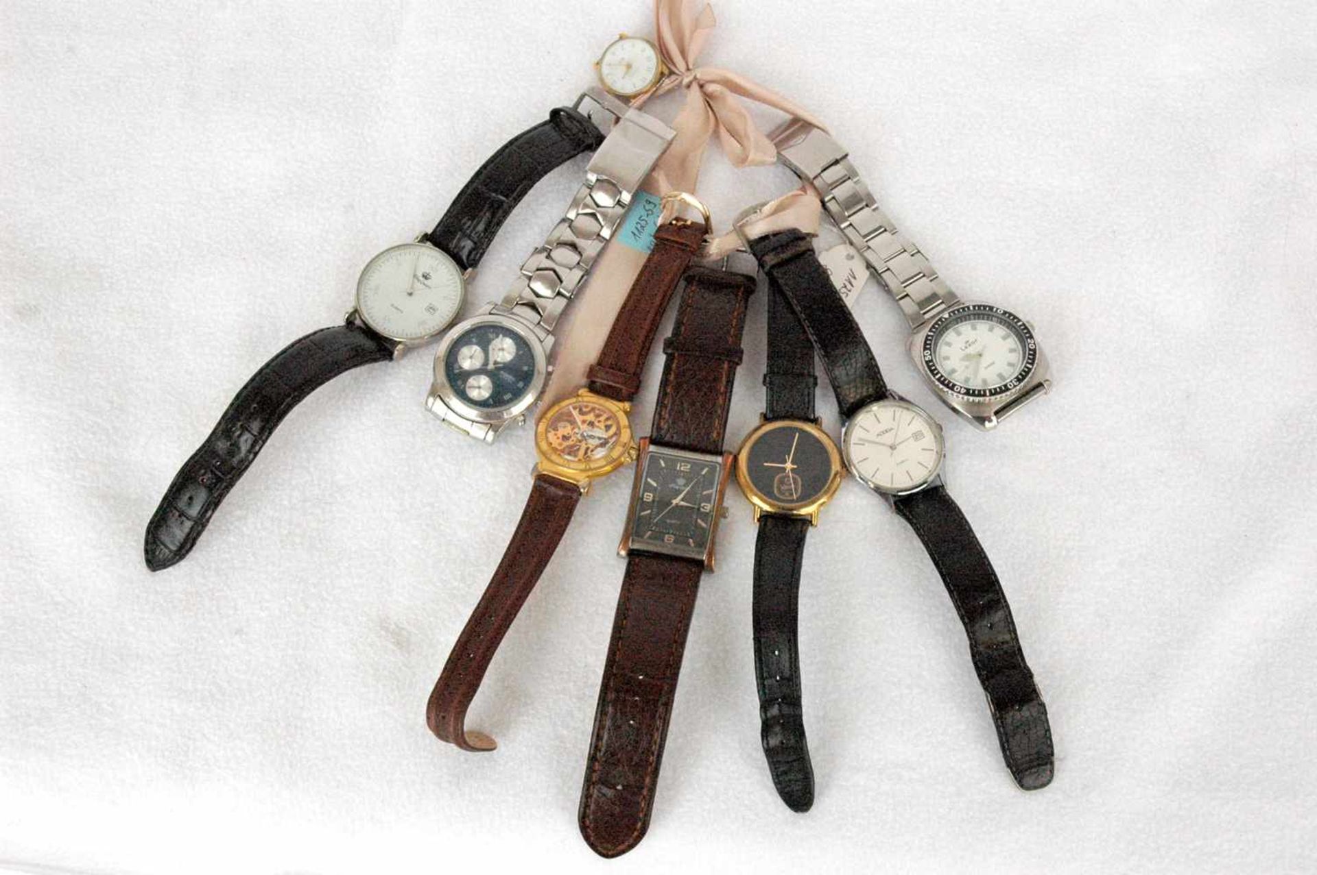 8 Armbanduhren: Adora, 2x King Quartz, Lexor, Fossil, WE