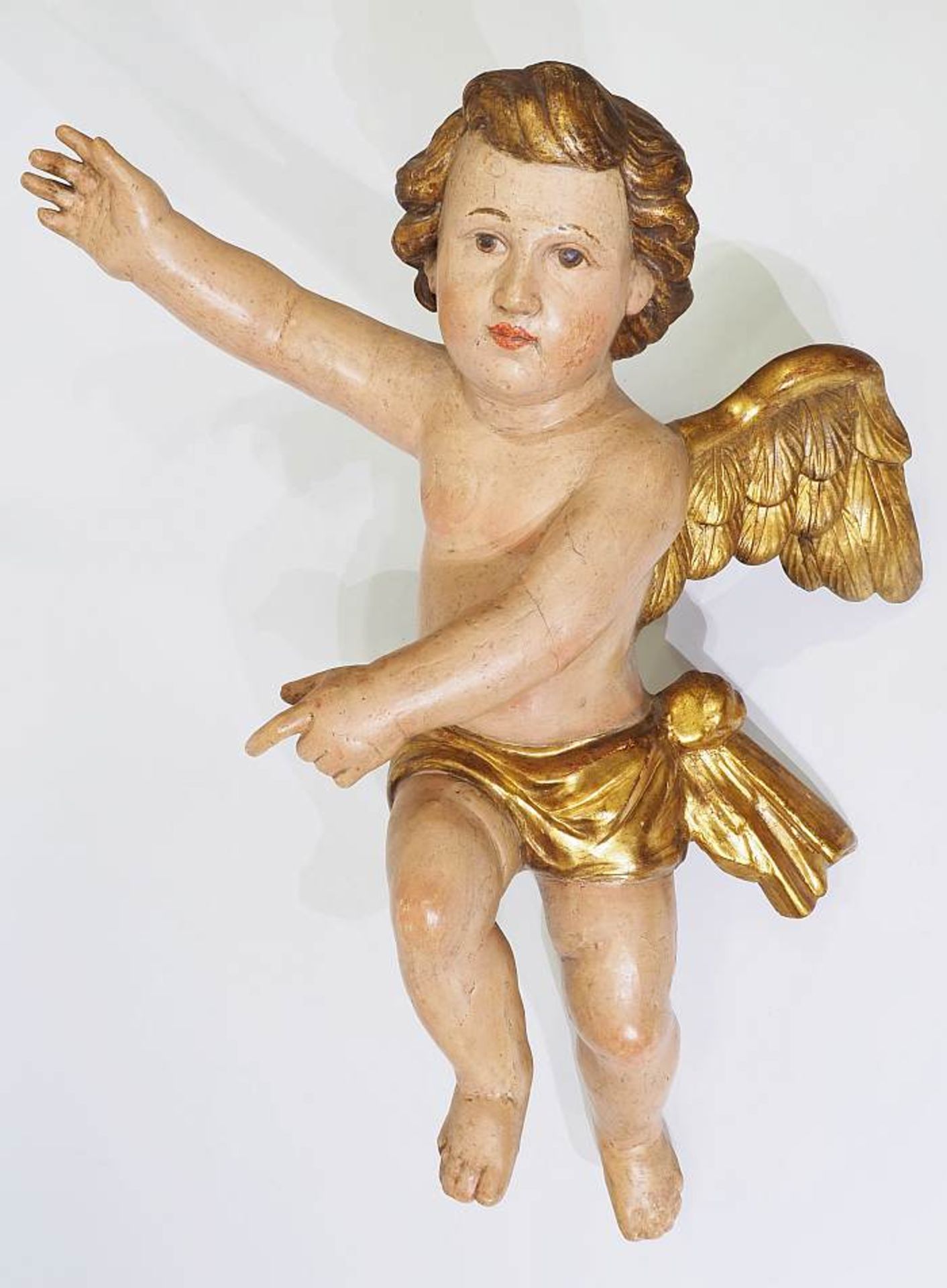 Schwebender Barock-Engel.Schwebender Barock-Engel. 20. Jahrhundert. Holz, farbig gefasst, partiell