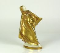 Porzellanfigur (Mitte 20.Jh.)mit goldenem Umhang; in tänzerischer Pose; auf ovalem Sockel mit