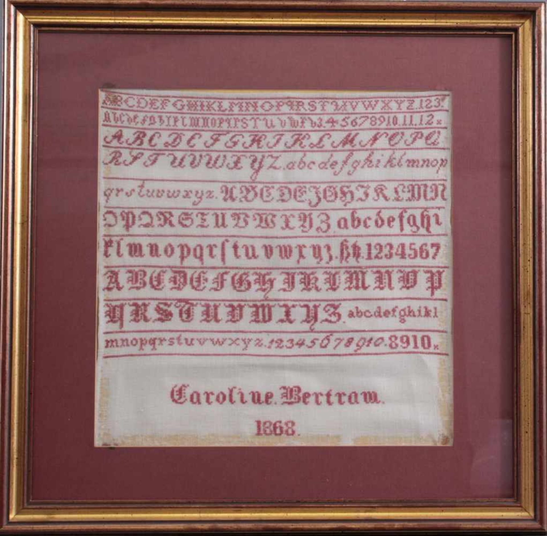Stickbild von 1868Leinen mit rotem Faden, Alphabet und Zahlen, bezeichnet Caroline Bertram,