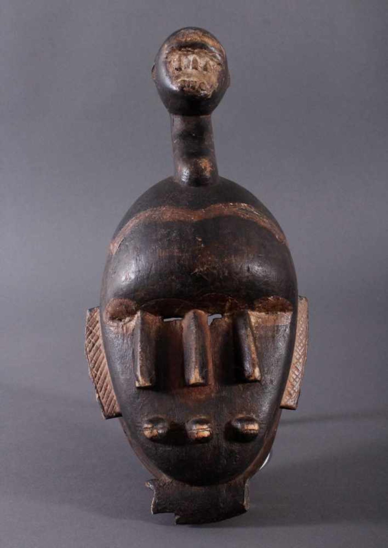 Antike Kpelie-Maske, SenufoHolz geschnitzt, geschwärztes, leicht glänzendes, mittelbraunes Holz