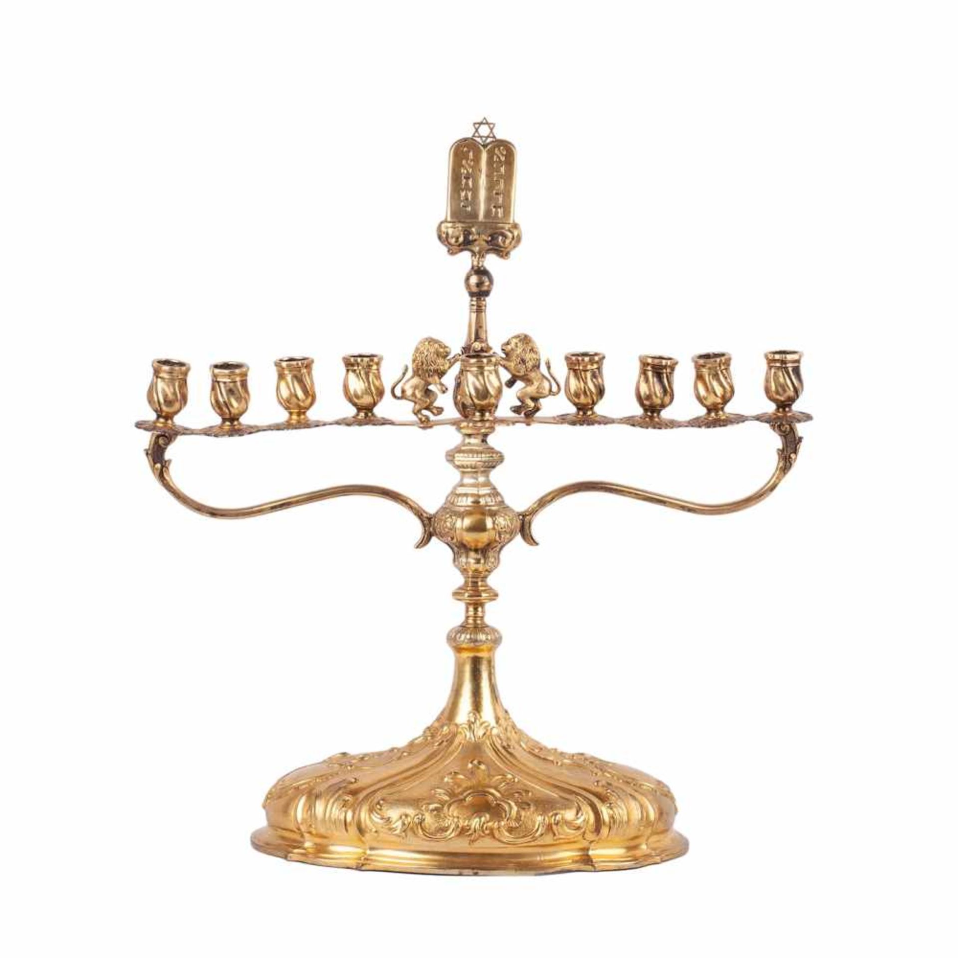 An impressive rococo style MenorahAn impressive rococo style Menorah. Base - hand gilded metal,