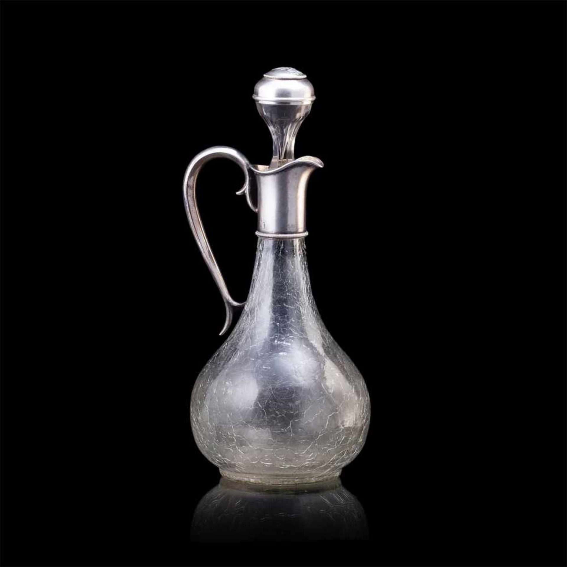 A Faberge silver-gilt and cut-glass carafeA Faberge silver-gilt and cut-glass (crackle decor) carafe