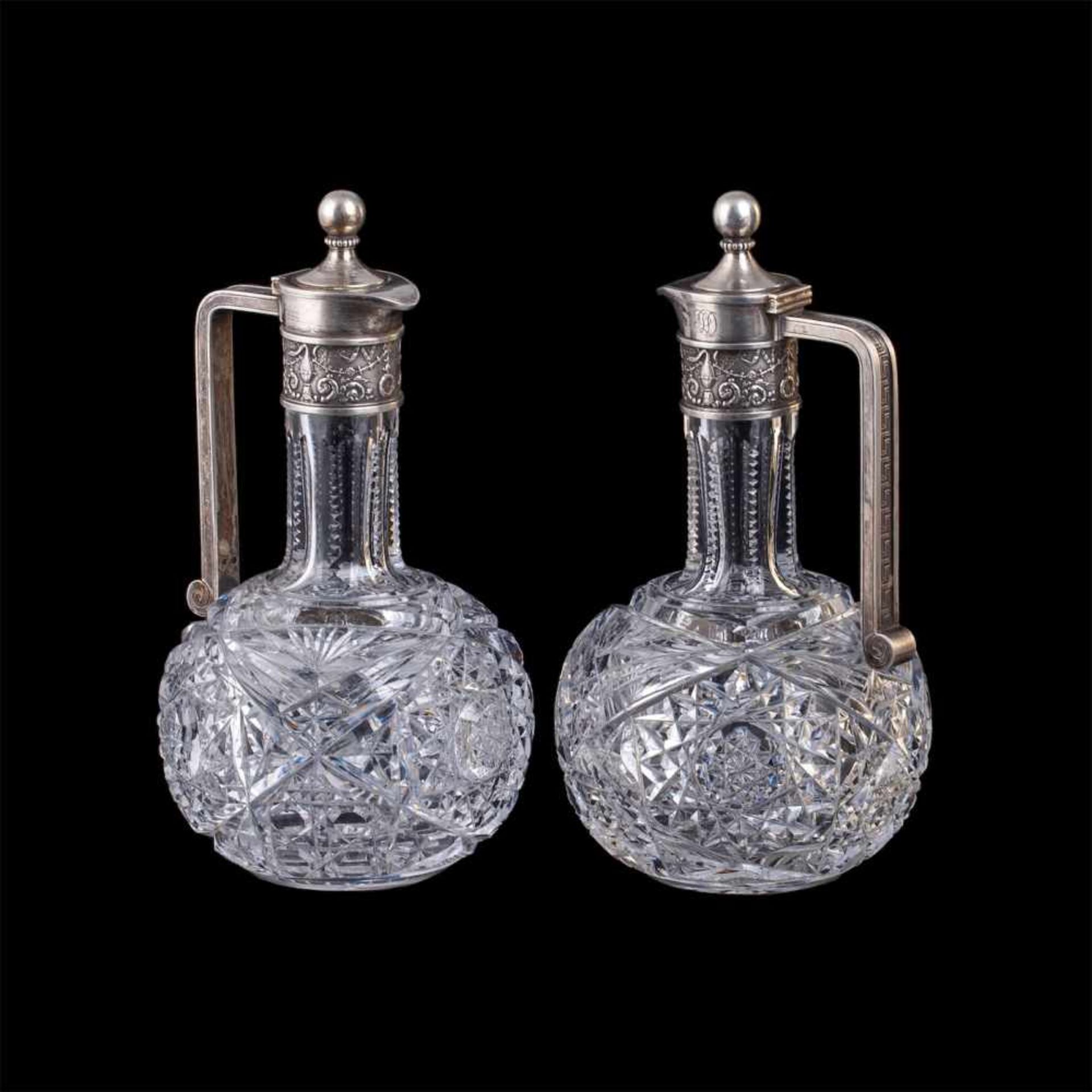 A pair of Faberge silver and cut-glass decantersA pair of Faberge silver-gilt and cut-glass