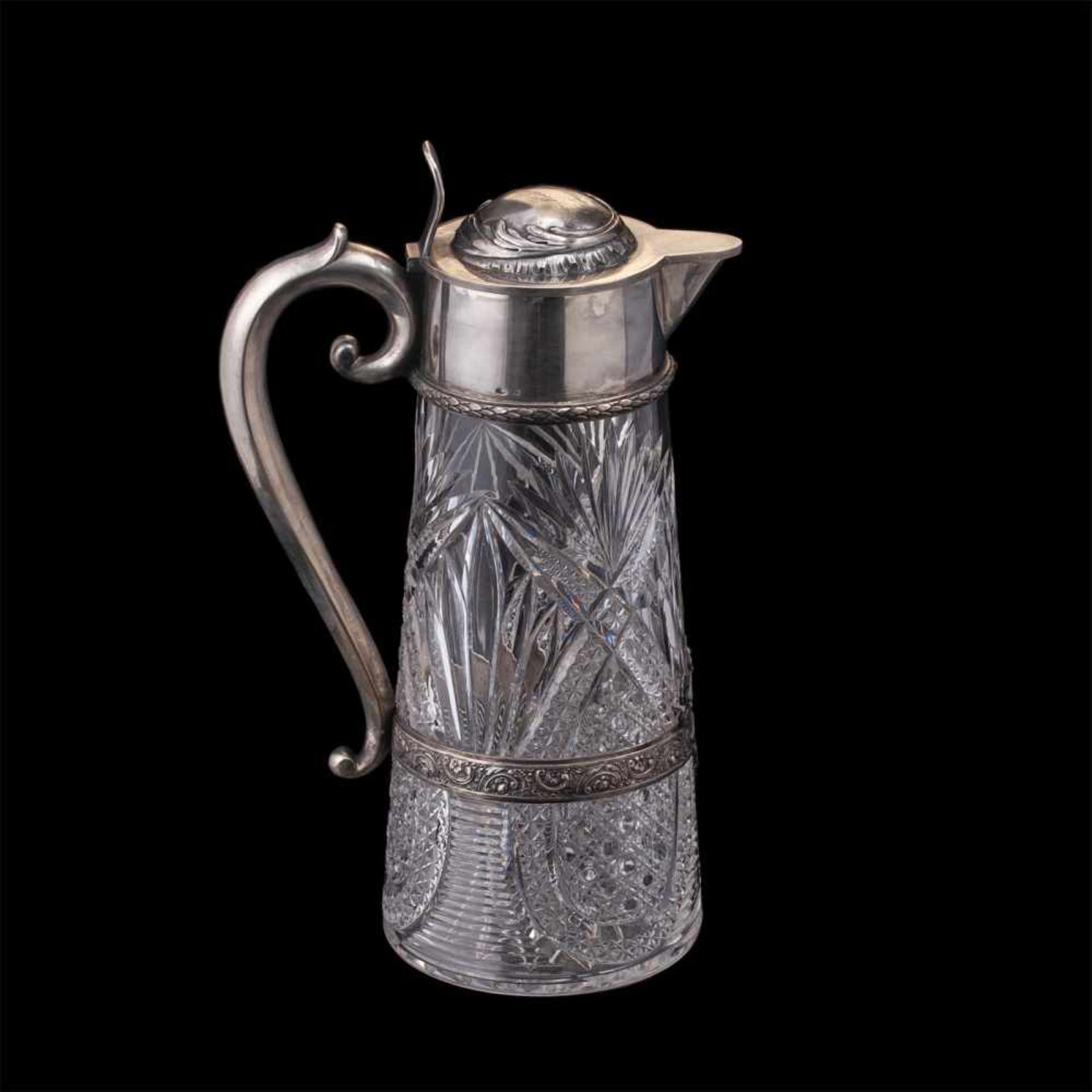 A Russian silver-gilt and cut-glass decanterA Russian silver-gilt and cut-glass decanter in