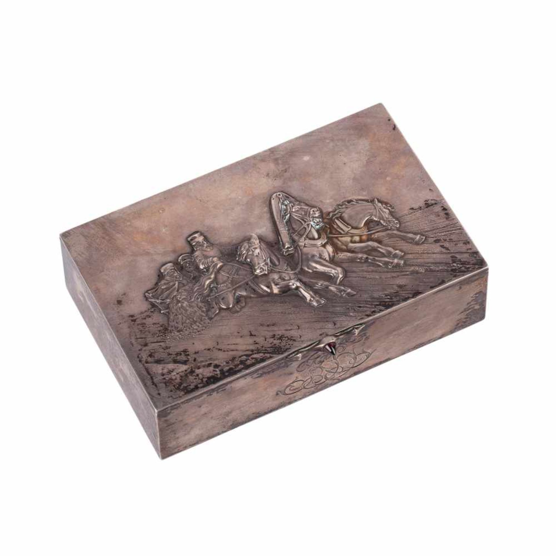 A Russian cigar box “Winter Troyka”A Russian cast silver-gilt and gem-set cigar box “Winter Troyka”.