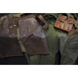A mid 20th century French leather jerkin; mechanics coveralls; an ammunition pouch;