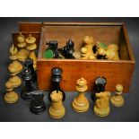 A boxwood and ebonised Staunton pattern chess set, the Kings 10.