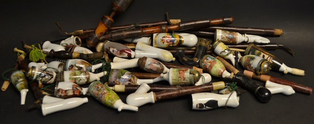 A collection of 19th century German porcelain pipes, various subjects,